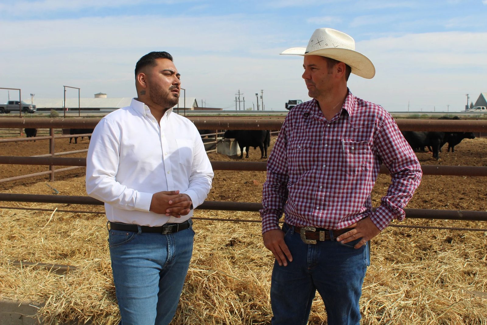 Guillermo and a rancher at the feedlot.