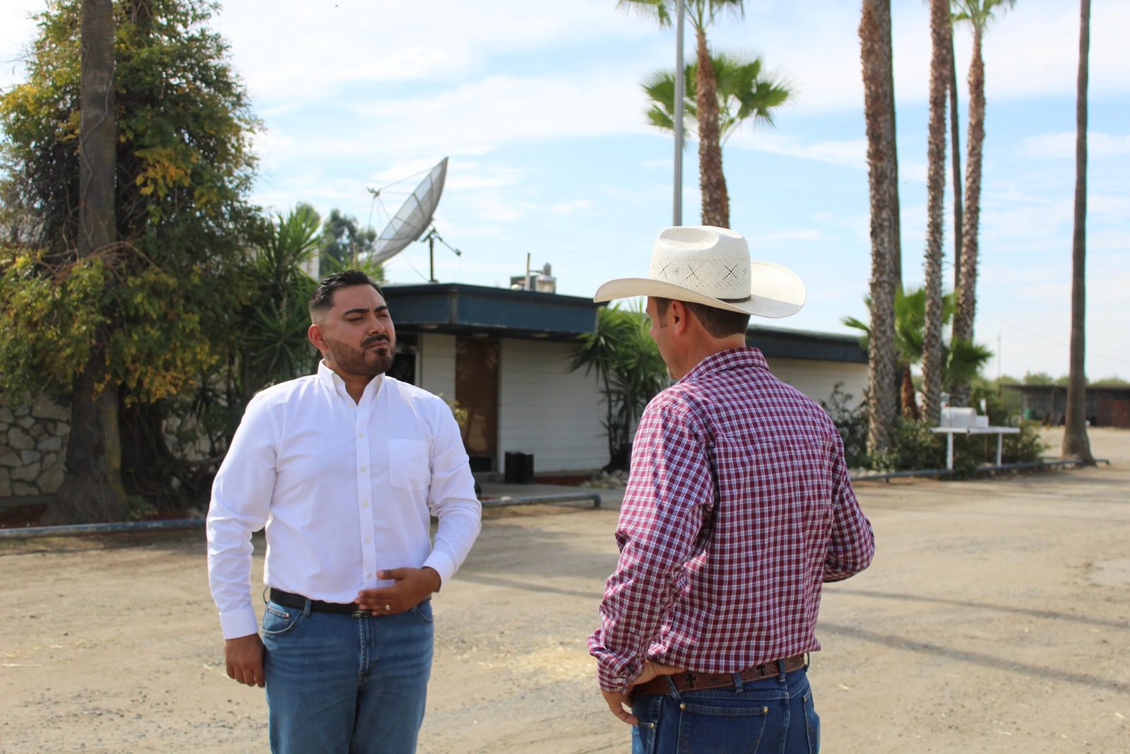 Guillermo talking with a rancher.